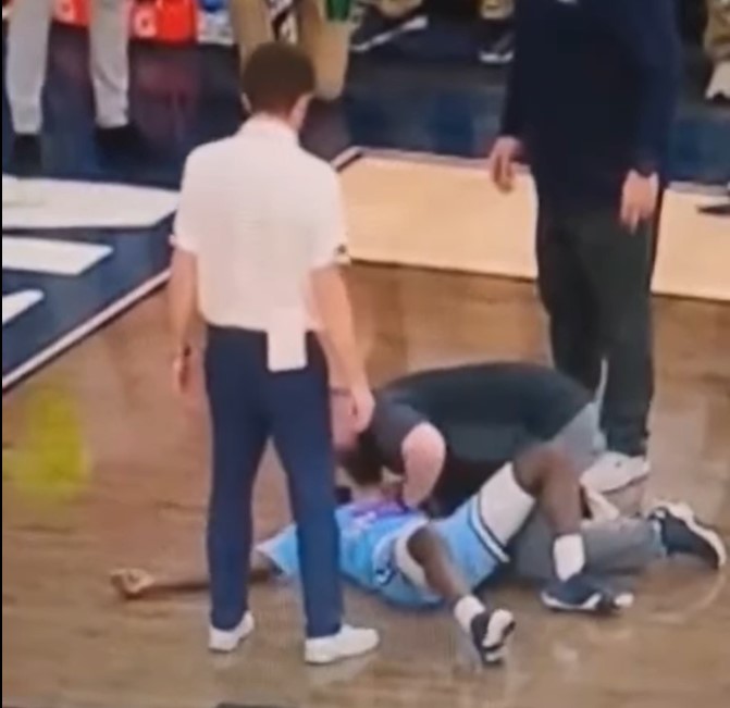 NCAA basketball player collapses on court during game, school had